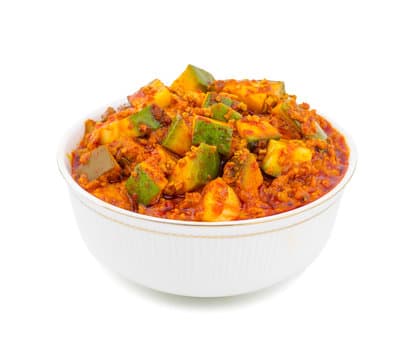 Indian family cooking traditional pickles together